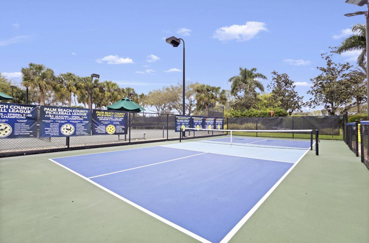 14841 Strand Lane, Unit 14841 Delray Beach, FL 33446 - Photo 40 of 43 a view of a tennis court