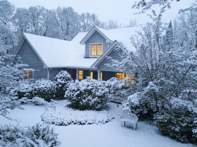 a front view of house with yard and seating