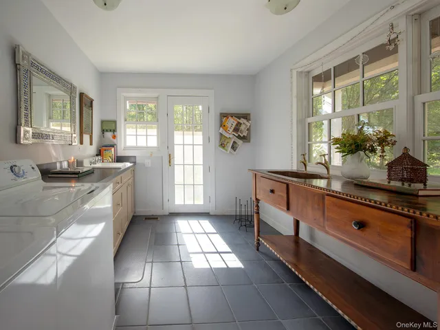a large kitchen with a large window