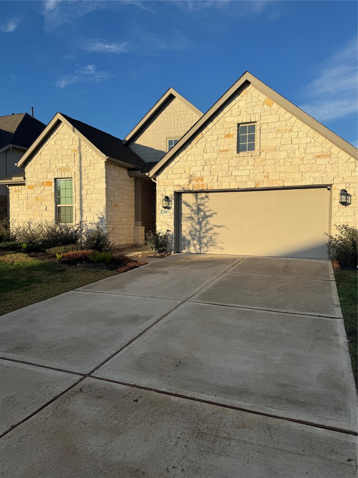 2911 Cooper Hawk Lane Richmond, TX 77406 - Photo 2 of 27 a front view of a house with a yard