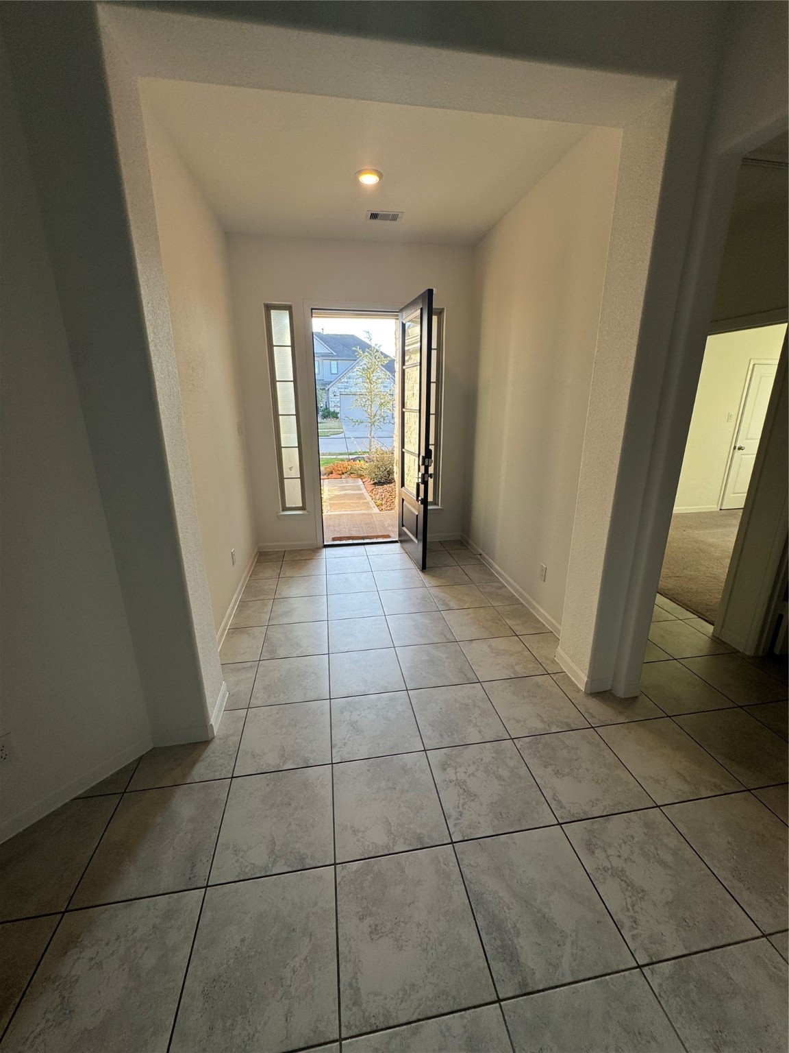2911 Cooper Hawk Lane Richmond, TX 77406 - Photo 3 of 27 a view of a livingroom with an empty space and a window