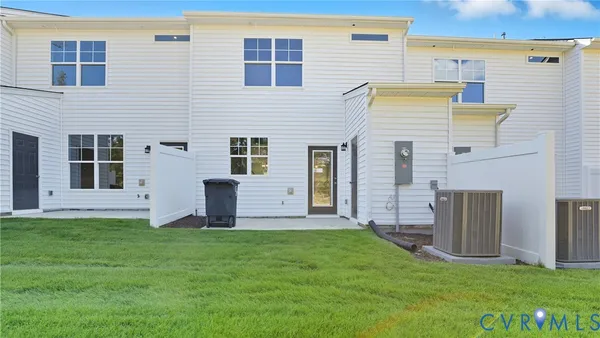 a view of a house with a yard and stairs