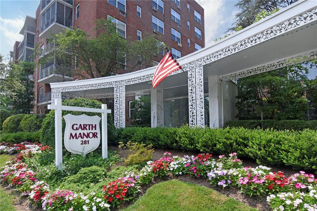 281 Garth Road, Unit B1A Scarsdale, NY 10583 - Photo 1 of 1 a sign that is in front of flowers