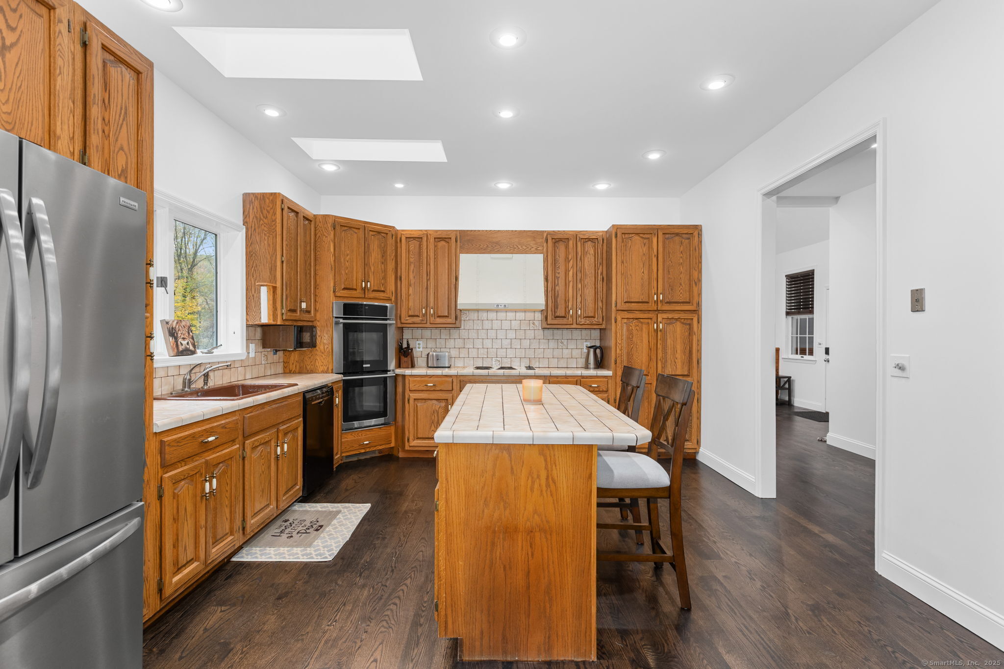 17 Curtis Drive Sherman, CT 06784 - Photo 12 of 34 a large kitchen with a large window and stainless steel appliances