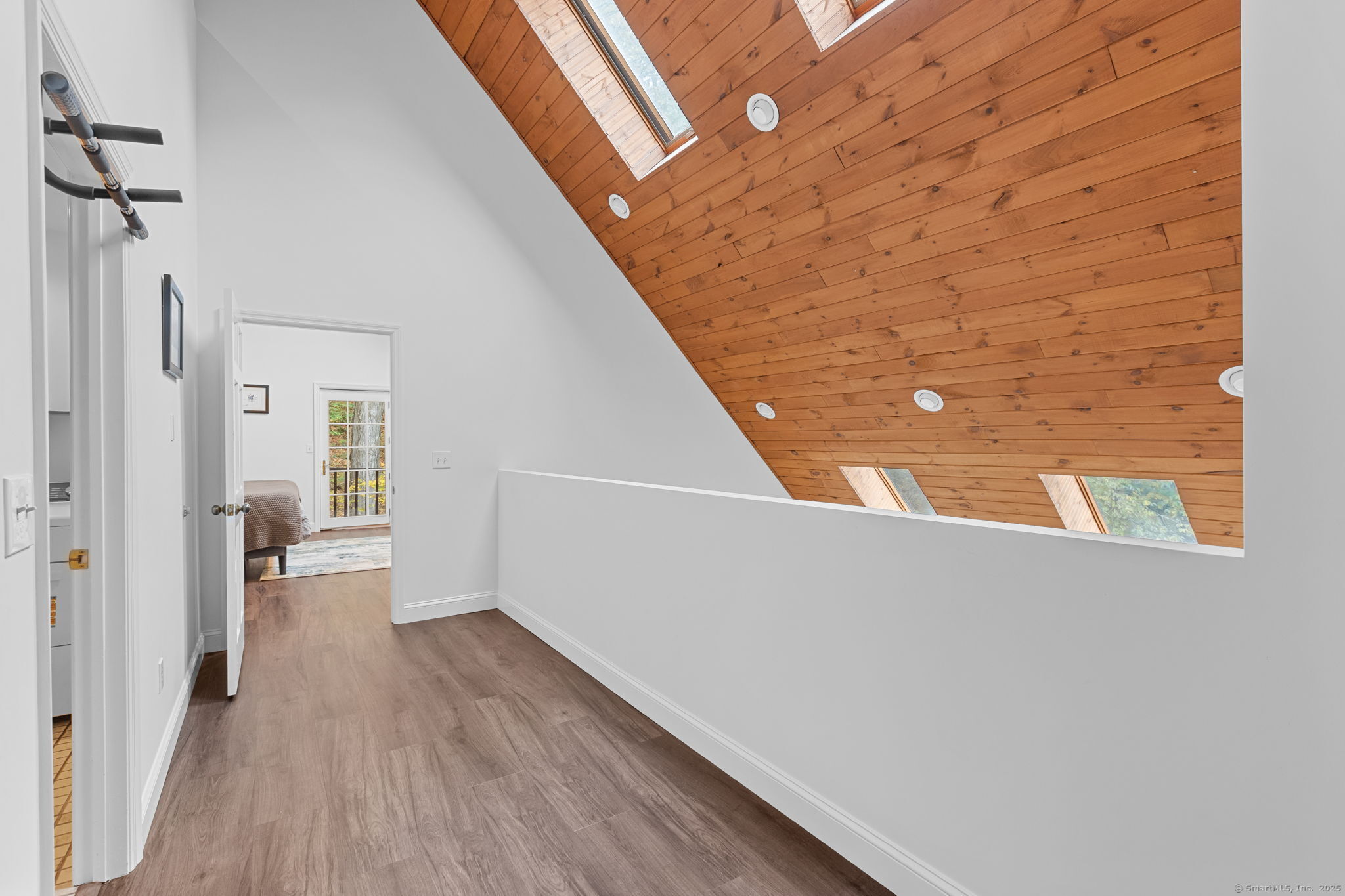 17 Curtis Drive Sherman, CT 06784 - Photo 18 of 34 a view of a hallway with wooden floor and staircase