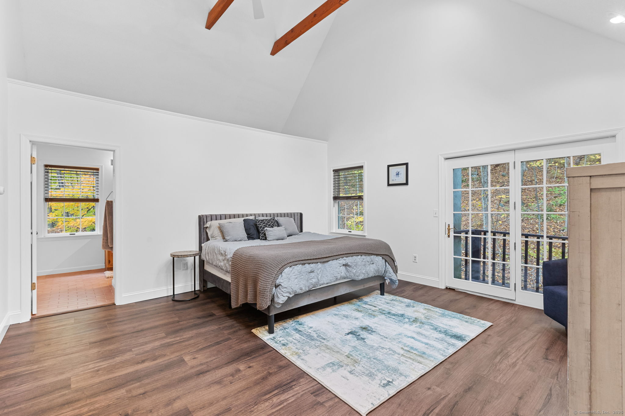 17 Curtis Drive Sherman, CT 06784 - Photo 20 of 34 a bedroom with a bed and wooden floor