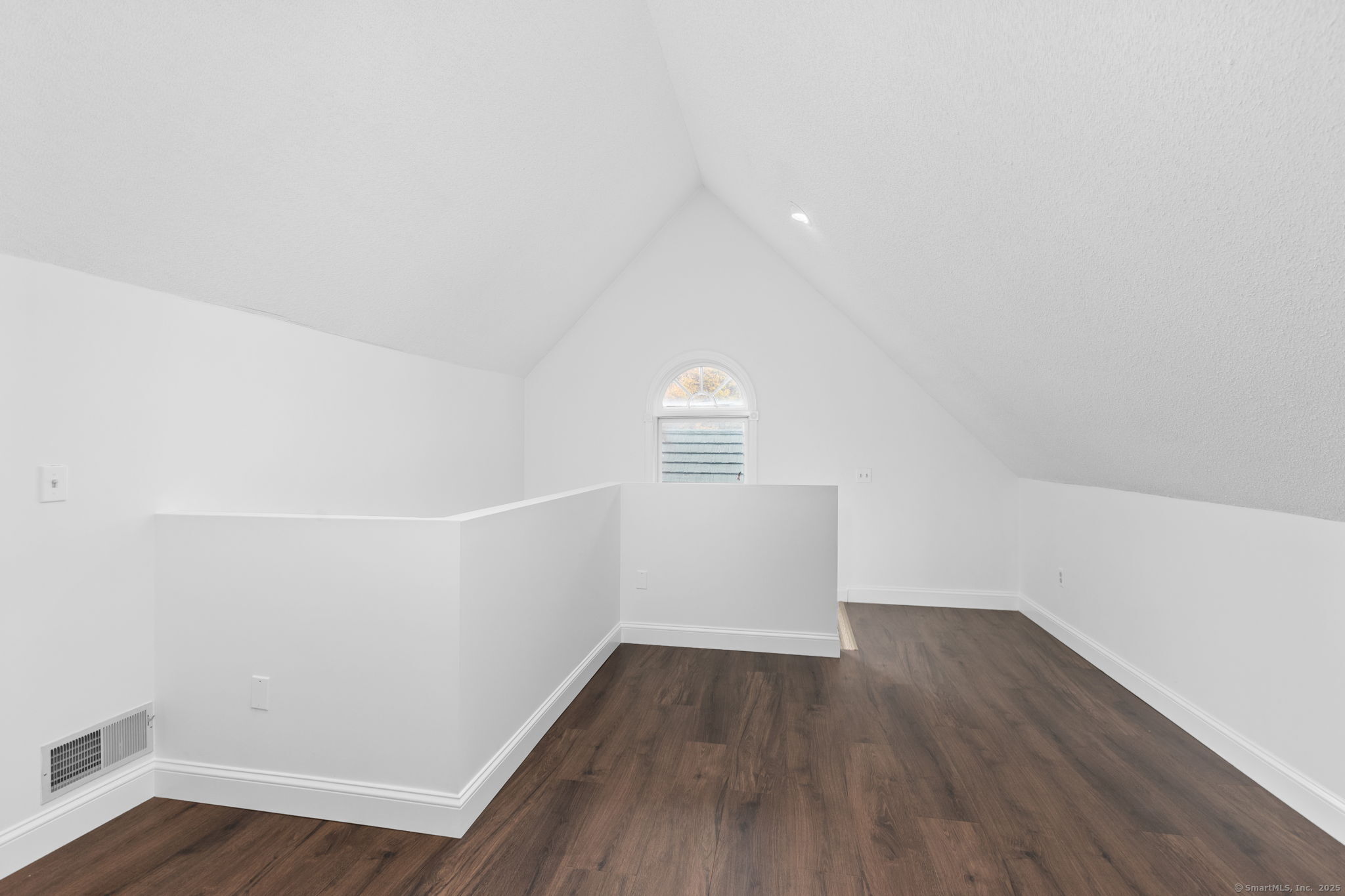 17 Curtis Drive Sherman, CT 06784 - Photo 26 of 34 a view of an empty room with wooden floor and white walls