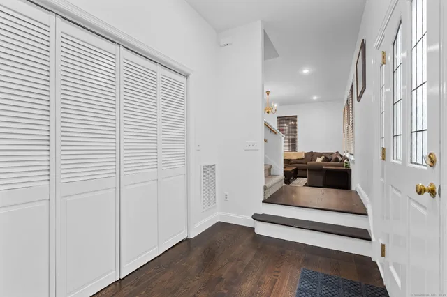 a hallway view with staircase