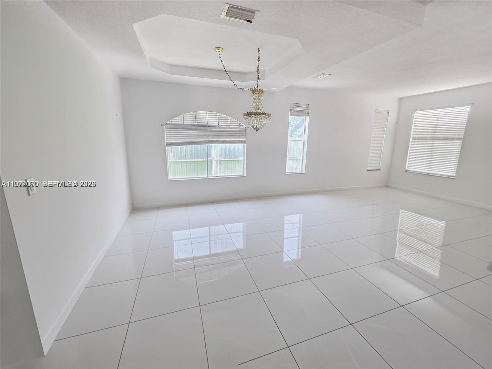 15843 Southwest 139th Street Miami, FL 33196 - Photo 13 of 39 a view of an empty room with a window
