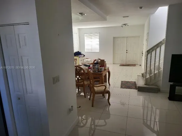 a view of a dining room with furniture