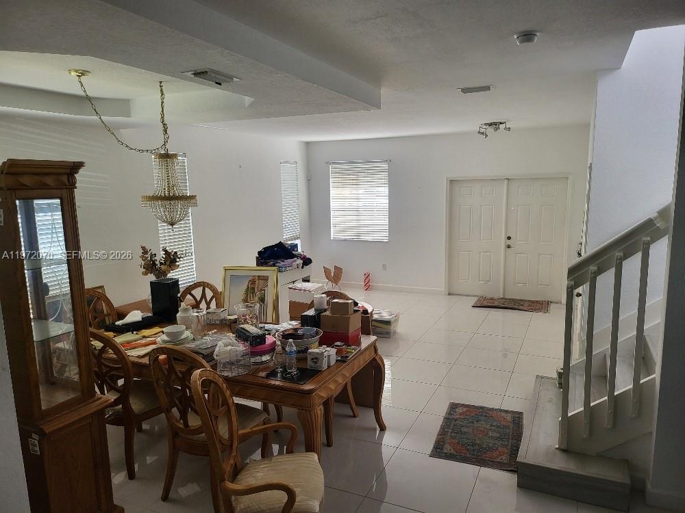 15843 Southwest 139th Street Miami, FL 33196 - Photo 20 of 39 a view of a dining room with furniture