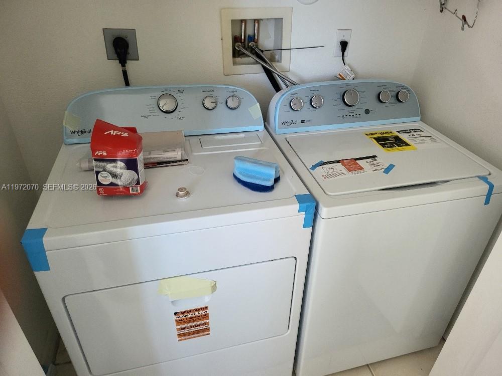 15843 Southwest 139th Street Miami, FL 33196 - Photo 29 of 39 a utility room with dryer and washer