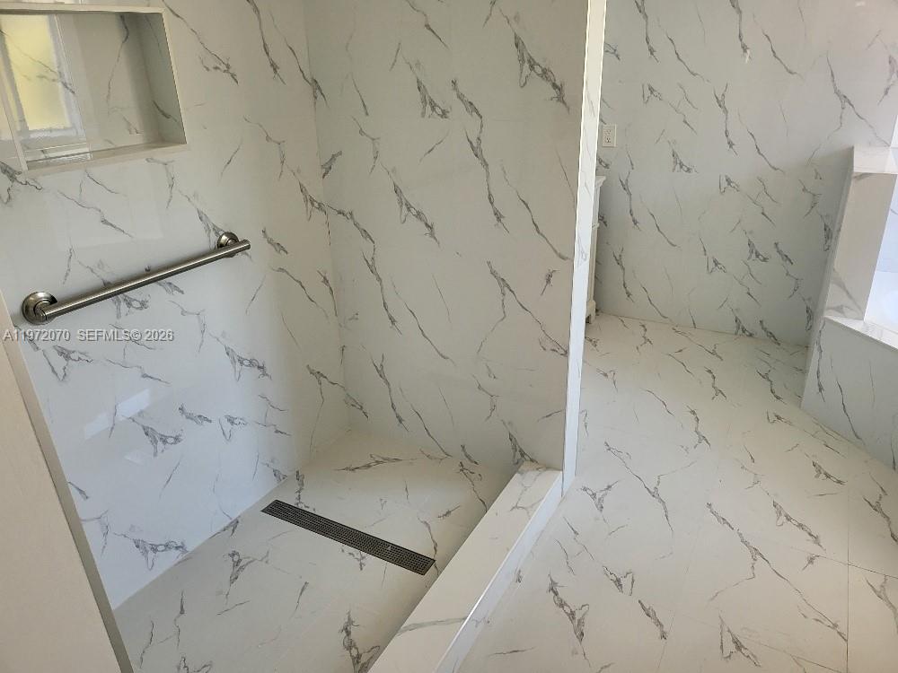 15843 Southwest 139th Street Miami, FL 33196 - Photo 30 of 39 a bathroom with a bathtub