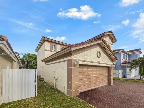 a view of a house with a garage