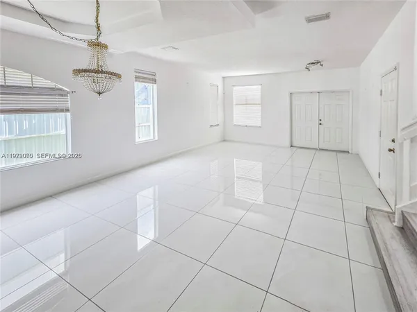 a view of an empty room and window