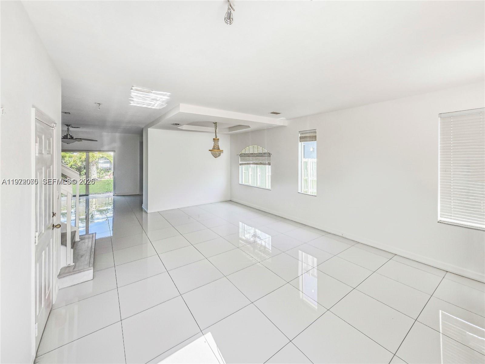 15843 Southwest 139th Street Miami, FL 33196 - Photo 10 of 39 a view of an empty room and window