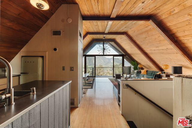a view of balcony with two chairs and a table