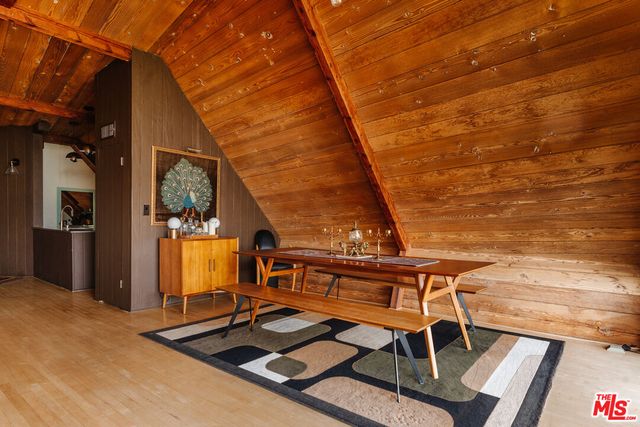 a bathroom with a toilet and a mirror