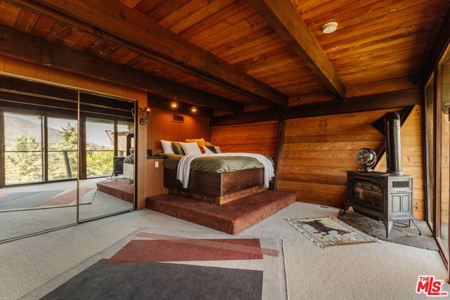 a room with gym equipment and a rug