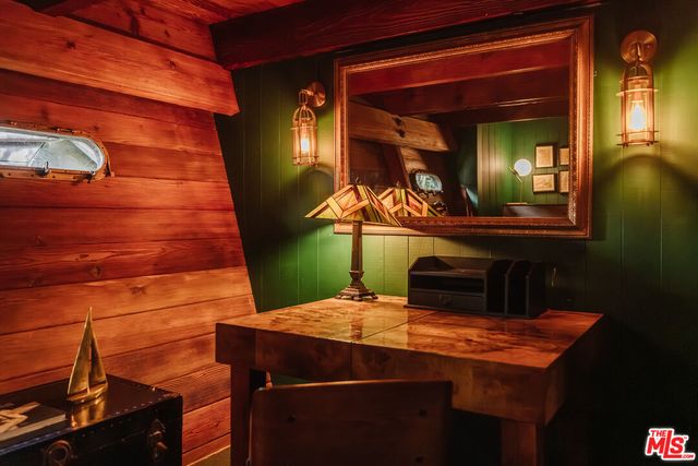 a bathroom with a sink shower and a mirror
