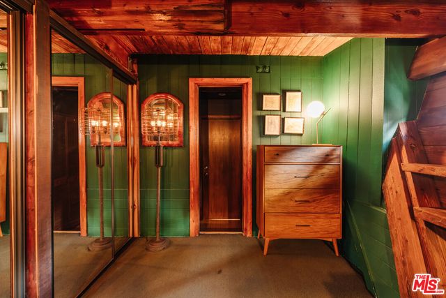 a living room with blue lights with furniture
