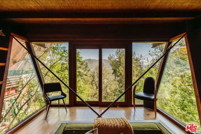 a view of a patio with table and chairs with wooden floor