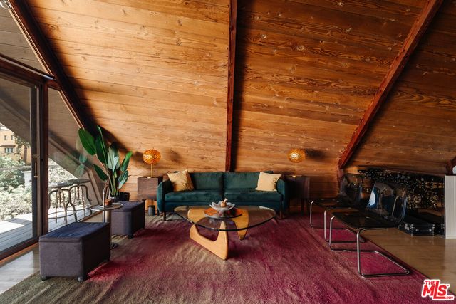 a outdoor living space with furniture and a rug