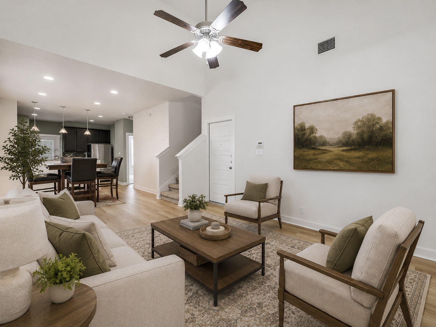 2101 Rivers Edge Way, Unit 29 Austin, TX 78741 - Photo 6 of 38 Virtually Staged. Open-concept living space featuring wood-finish flooring, a vaulted ceiling with a ceiling fan, and recessed lighting