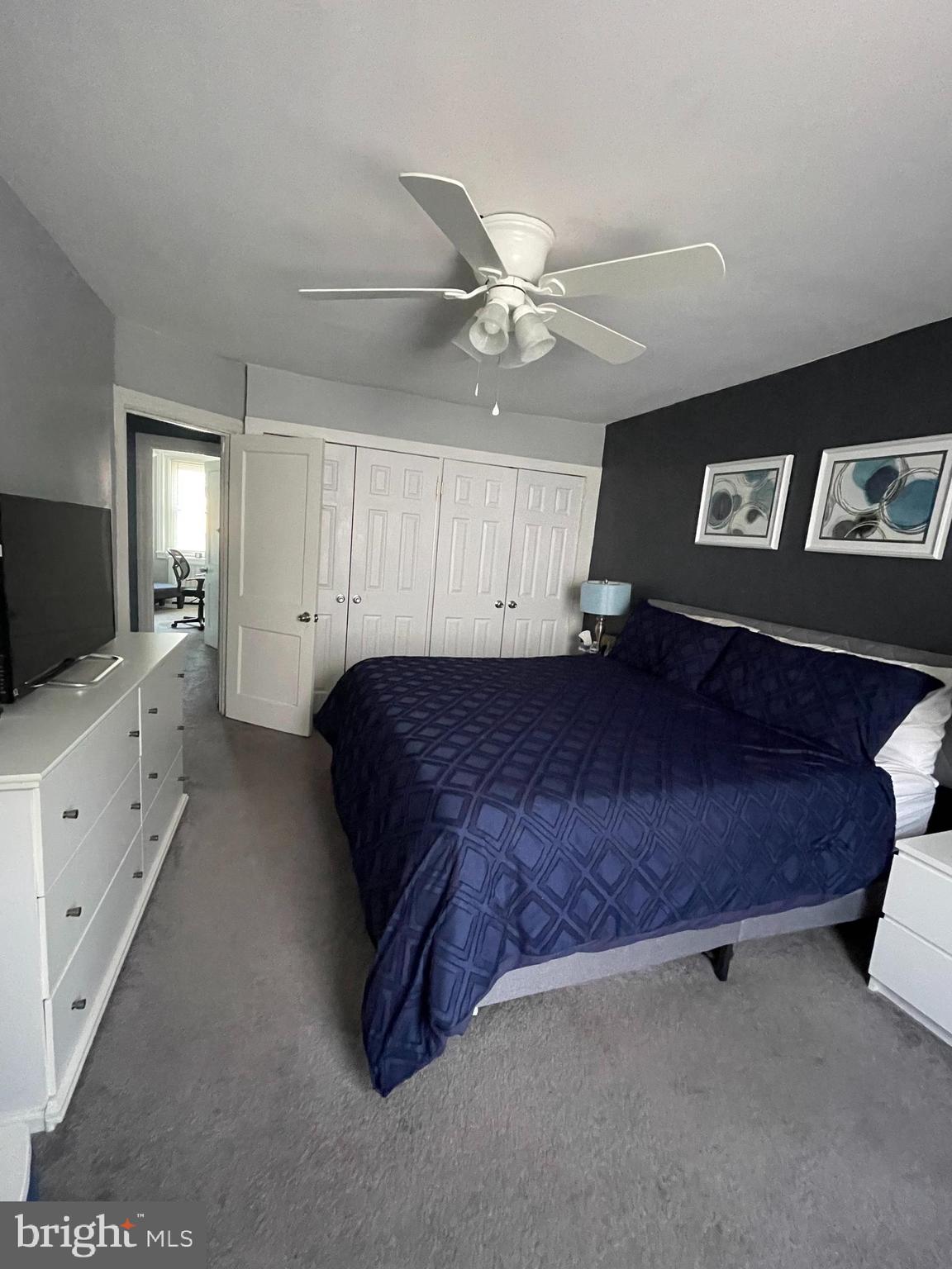 5452 Euclid Street Philadelphia, PA 19131 - Photo 13 of 22 a spacious bedroom with a bed and a flat screen tv