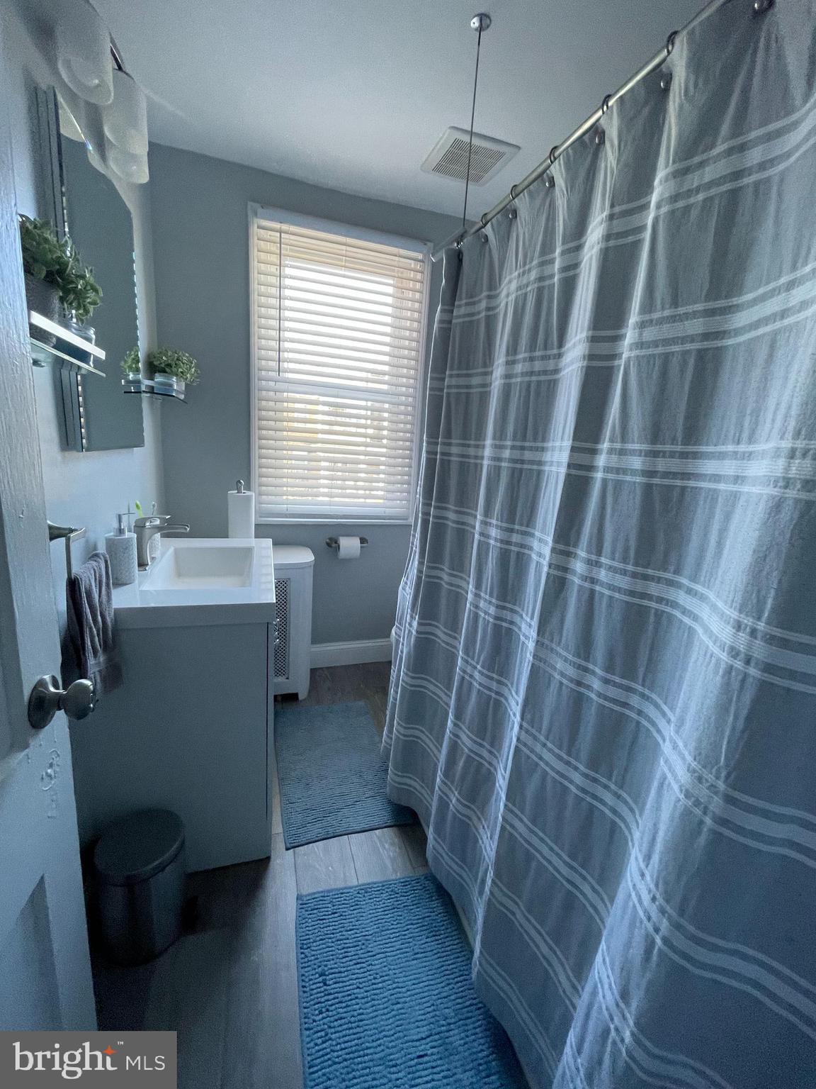 5452 Euclid Street Philadelphia, PA 19131 - Photo 14 of 22 a bathroom with a sink toilet and shower