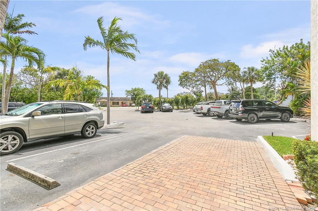 3129 Southeast Indian Street, Unit 3 Stuart, FL 34997 - Photo 28 of 28 a view of a city street with cars