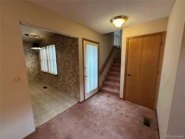 a view of a hallway with staircase
