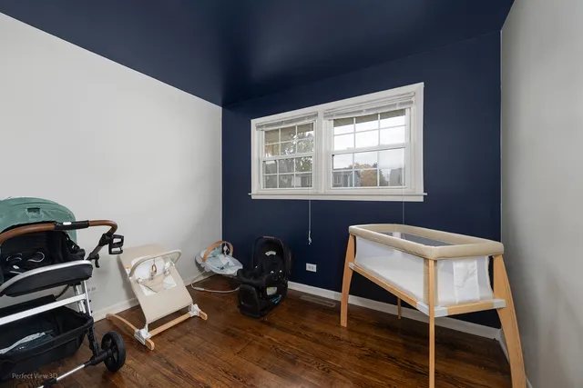 a room with a chair and a window