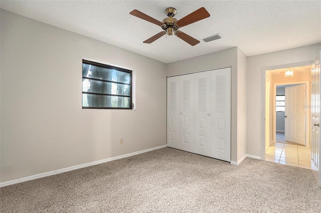 7320 Auburn Lane New Port Richey, FL 34654 - Photo 21 of 28 an empty room with closet and windows