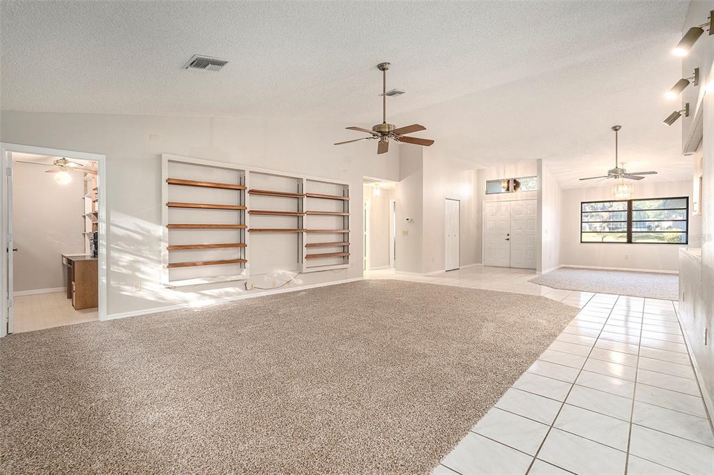 7320 Auburn Lane New Port Richey, FL 34654 - Photo 10 of 28 a view of a livingroom with a staircase