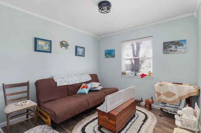 a living room with furniture a couch and a window