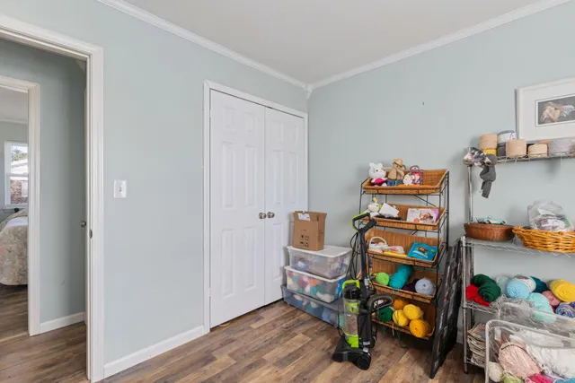 a room with toys and wooden floor