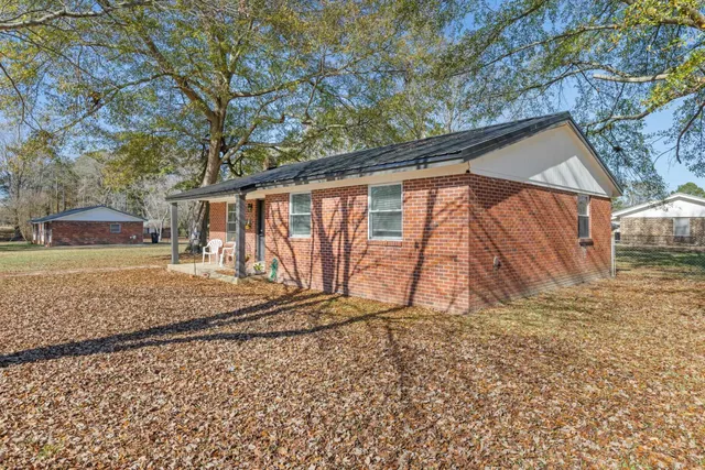 a backyard of a house with lots of green space