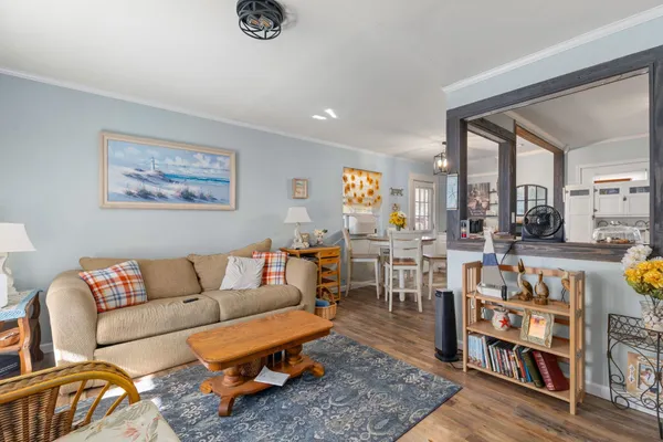 a living room with furniture and a rug