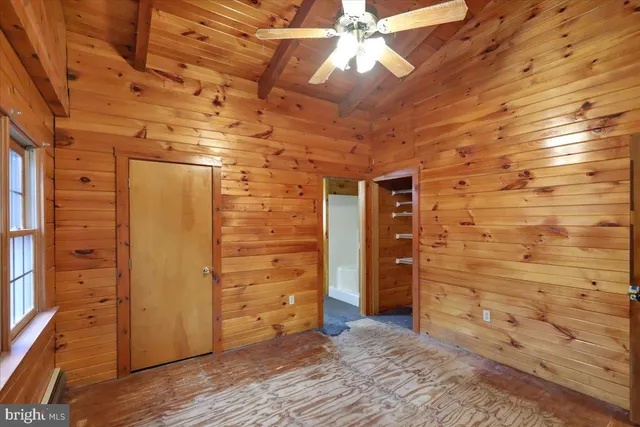 a view of an empty room and a window