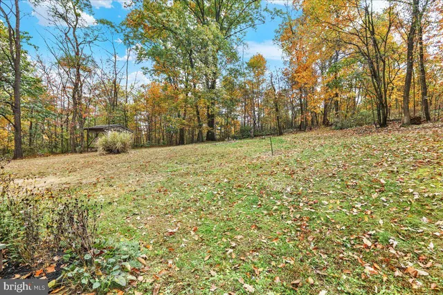 an aerial view of a house with outdoor space
