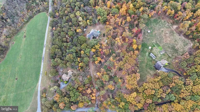 an aerial view of residential houses with outdoor space