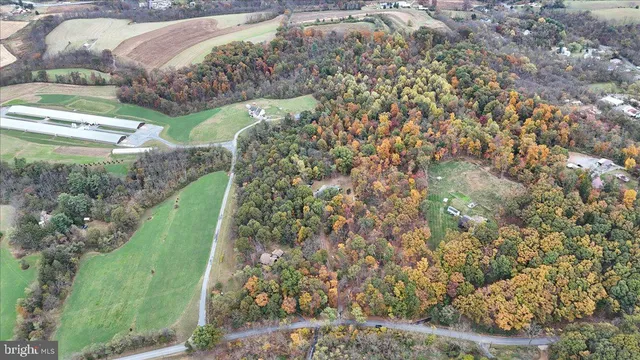 a picture of a room with a white wall and a window