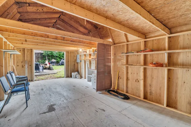 a kitchen with stainless steel appliances a sink dishwasher stove refrigerator and cabinets with wooden floor