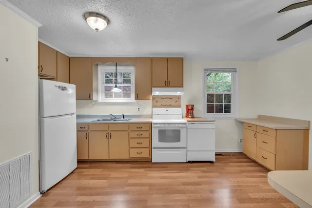 a view of a living room with hardwood floor