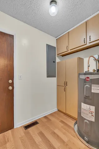 a view of hallway with wooden floor