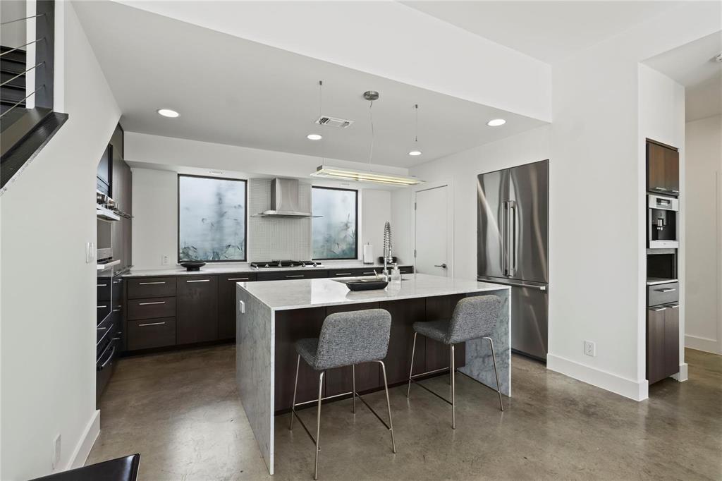 6 Vanguard Way Dallas, TX 75243 - Photo 11 of 35 a large kitchen with a table and chairs