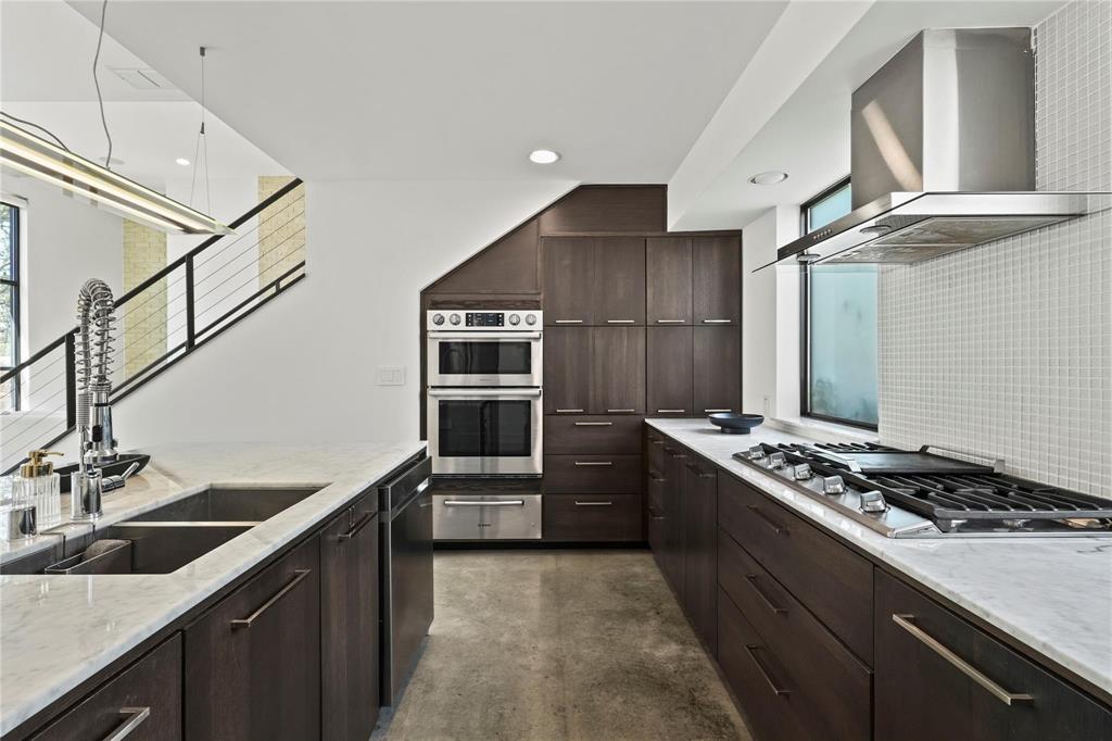 6 Vanguard Way Dallas, TX 75243 - Photo 12 of 35 a kitchen with granite countertop a sink stove and refrigerator