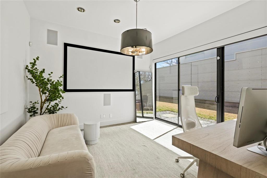 6 Vanguard Way Dallas, TX 75243 - Photo 16 of 35 a living room with a balcony a bed and a potted plant