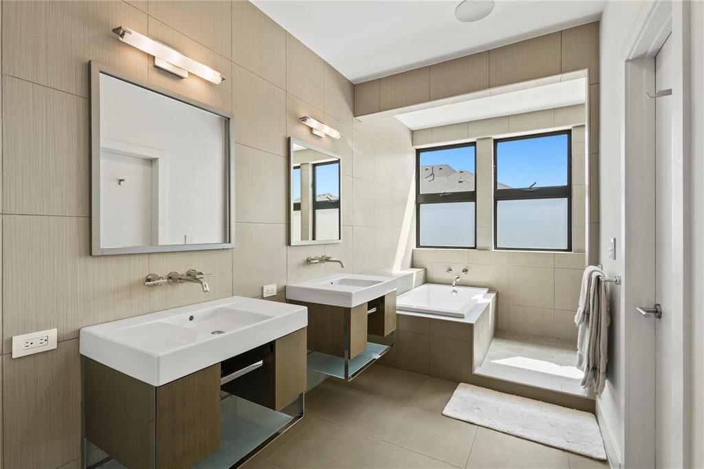 6 Vanguard Way Dallas, TX 75243 - Photo 26 of 35 a bathroom with a sink and a mirror